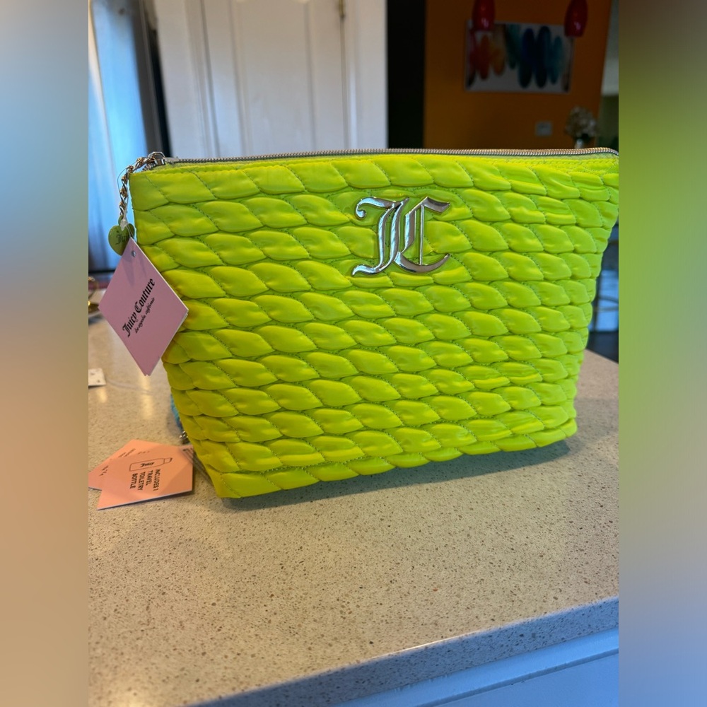 Description
Juicy Couture Travel Cosmetic Bag with travel bottle.
